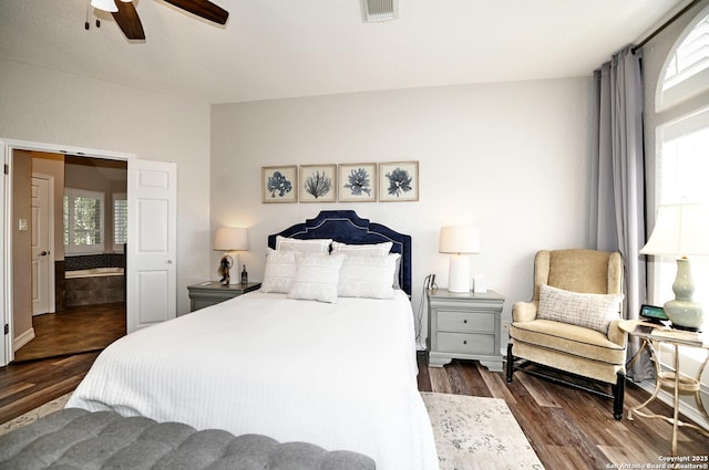 21539 Bubbling Crk, San Antonio, TX 78259 - bedroom with multiple windows, wood finished floors, and a ceiling fan