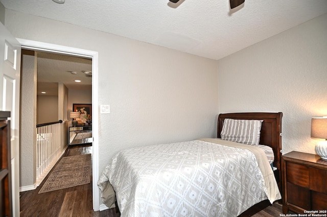 21539 Bubbling Crk, San Antonio, TX 78259 - bedroom with wood finished floors, a textured ceiling, and a ceiling fan
