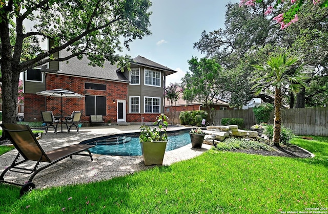 21539 Bubbling Crk, San Antonio, TX 78259 - back of house featuring a patio area, brick siding, and a fenced backyard