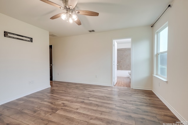 8438 Cordova Pt, San Antonio, TX 78252 - empty room with wood finished floors and a ceiling fan