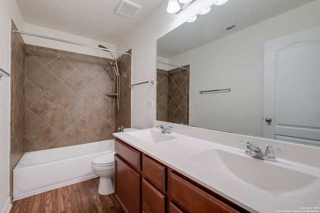 8438 Cordova Pt, San Antonio, TX 78252 - bathroom with double vanity, wood finished floors, and shower / bath combination
