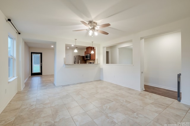 8438 Cordova Pt, San Antonio, TX 78252 - unfurnished living room featuring ceiling fan and baseboards