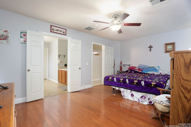 5124 Knollwood, Schertz, TX 78108 - bedroom featuring light wood finished floors, a ceiling fan, and ensuite bathroom