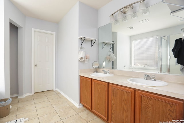 5124 Knollwood, Schertz, TX 78108 - bathroom with tile patterned floors, double vanity, and a shower with door