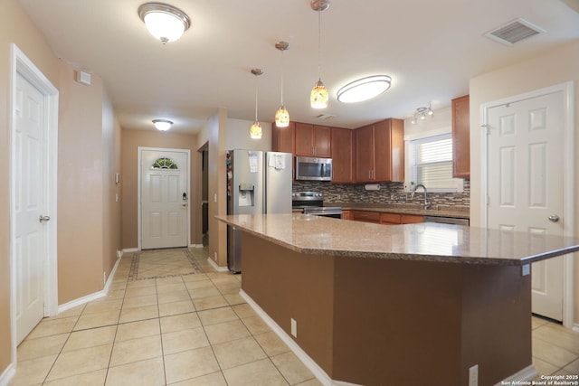 5124 Knollwood, Schertz, TX 78108 - kitchen featuring stainless steel appliances, light tile patterned flooring, decorative backsplash, and light stone counters