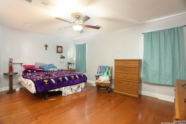 5124 Knollwood, Schertz, TX 78108 - bedroom featuring wood finished floors and a ceiling fan