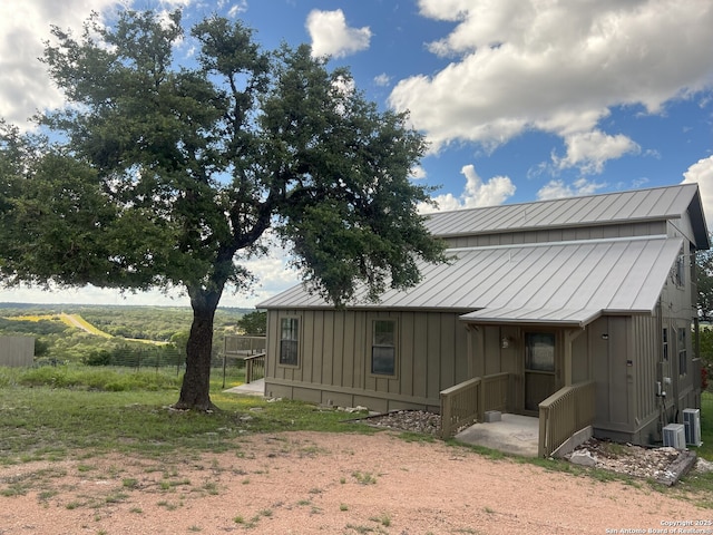 179 Cherry Springs Rd, Hunt, TX 78024 - rear view of property featuring board and batten siding, a standing seam roof, and a metal roof