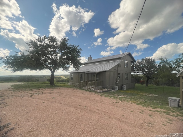179 Cherry Springs Rd, Hunt, TX 78024 - view of front facade featuring a metal roof, a chimney, and dirt driveway