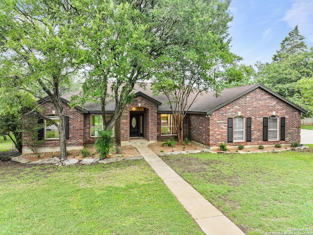 29732 Cojak Cir, Boerne, TX 78015 - view of front of property with a shingled roof, brick siding, and a front lawn