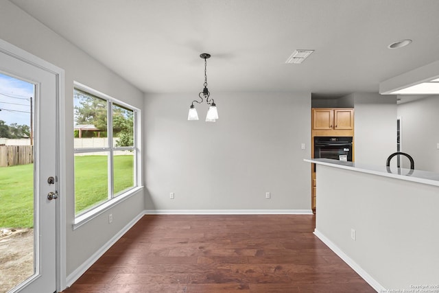 29732 Cojak Cir, Boerne, TX 78015 - unfurnished dining area with dark wood-style flooring and baseboards