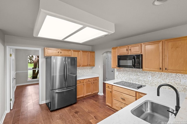 29732 Cojak Cir, Boerne, TX 78015 - kitchen with black appliances, backsplash, dark wood-type flooring, light countertops, and light brown cabinetry