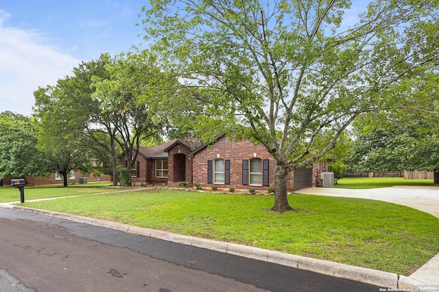 29732 Cojak Cir, Boerne, TX 78015 - view of front of home featuring brick siding, concrete driveway, and an attached garage