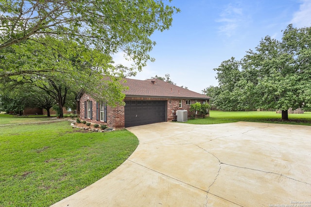 29732 Cojak Cir, Boerne, TX 78015 - view of home's exterior featuring brick siding, concrete driveway, a yard, a garage, and a shingled roof