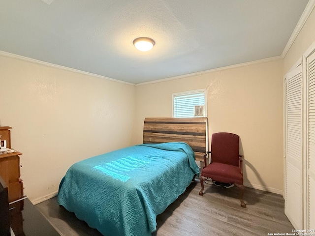 2434 Delgado, San Antonio, TX 78228 - bedroom featuring wood finished floors and crown molding