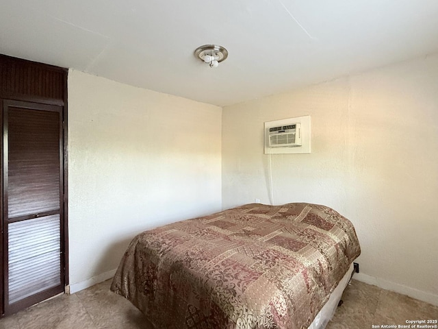 2434 Delgado, San Antonio, TX 78228 - bedroom featuring an AC wall unit and baseboards