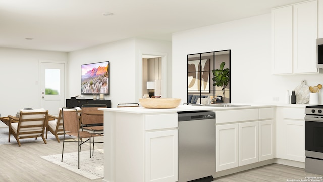 13463 Furyk Dr, San Antonio, TX 78221 - kitchen with appliances with stainless steel finishes, light wood-style floors, a peninsula, and white cabinetry