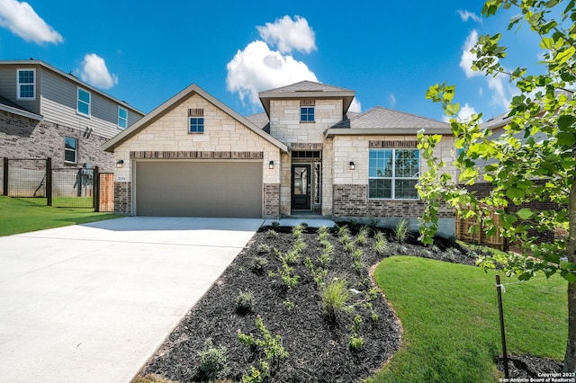 8948 San Carlos, Seguin, TX 78155 - view of front of property featuring a garage, driveway, brick siding, stone siding, and roof with shingles