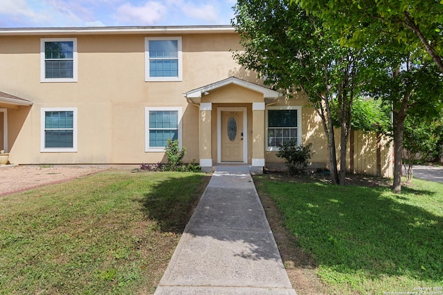 210 E Broadview, San Antonio, TX 78228 - view of front of property with stucco siding and a front lawn
