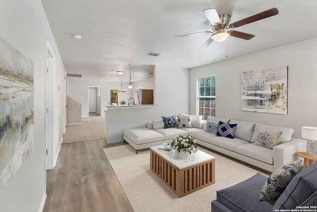 210 E Broadview, San Antonio, TX 78228 - living area with ceiling fan and light wood-type flooring