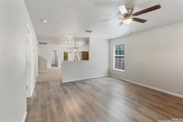 210 E Broadview, San Antonio, TX 78228 - unfurnished living room featuring light wood finished floors and a ceiling fan