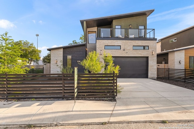 238 Cassiano St, San Antonio, TX 78204 - contemporary home with a balcony, a garage, concrete driveway, and stucco siding