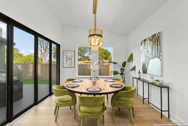 238 Cassiano St, San Antonio, TX 78204 - dining space with wood finished floors, plenty of natural light, and a chandelier
