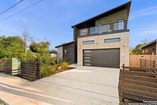 238 Cassiano St, San Antonio, TX 78204 - contemporary house with a balcony, a garage, and concrete driveway