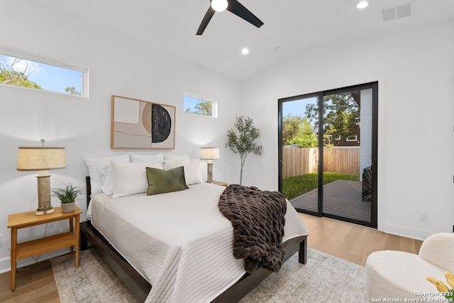 238 Cassiano St, San Antonio, TX 78204 - bedroom with access to outside, wood finished floors, multiple windows, recessed lighting, and vaulted ceiling
