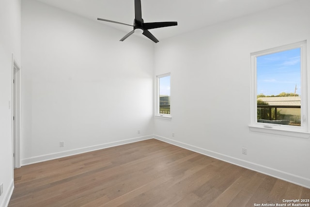238 Cassiano St, San Antonio, TX 78204 - empty room with healthy amount of natural light, wood finished floors, and ceiling fan