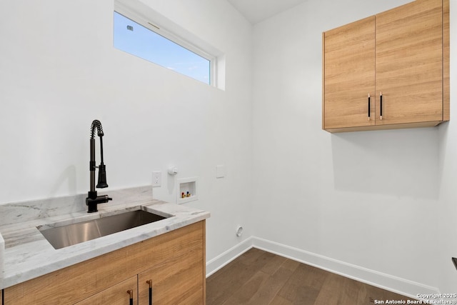 238 Cassiano St, San Antonio, TX 78204 - laundry room featuring cabinet space, hookup for a washing machine, dark wood-style flooring, and hookup for an electric dryer