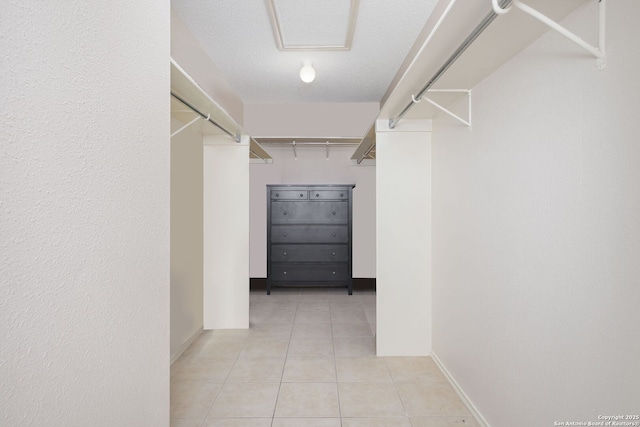 18706 Redriver, San Antonio, TX 78259 - walk in closet featuring light tile patterned flooring