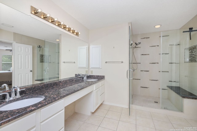 18706 Redriver, San Antonio, TX 78259 - full bathroom featuring double vanity, a shower stall, and tile patterned floors