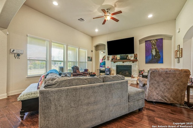 4603 Camden, San Antonio, TX 78261 - living area featuring a ceiling fan, a fireplace, recessed lighting, dark wood-style floors, and arched walkways