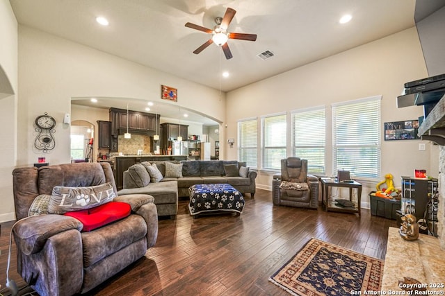 4603 Camden, San Antonio, TX 78261 - living room featuring arched walkways, a ceiling fan, dark wood finished floors, recessed lighting, and a fireplace