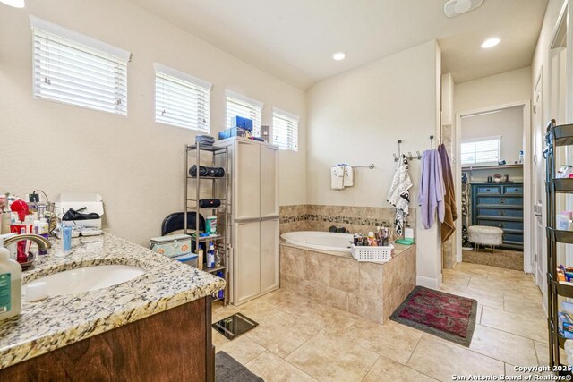 4603 Camden, San Antonio, TX 78261 - bathroom with a garden tub, tile patterned floors, vanity, and recessed lighting