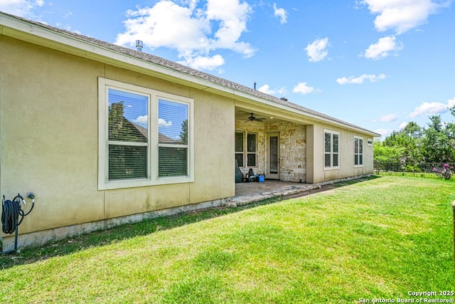 4603 Camden, San Antonio, TX 78261 - back of property featuring a ceiling fan, a patio area, and stucco siding