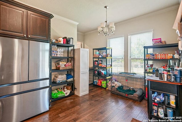 4603 Camden, San Antonio, TX 78261 - dining space with dark wood-style floors, a chandelier, and crown molding