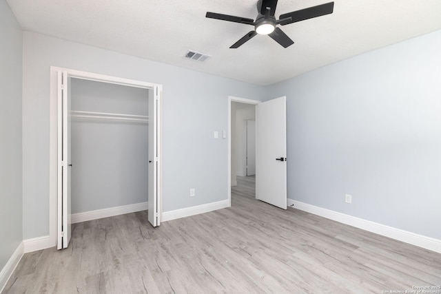 2165 Colleen Dr, Canyon Lake, TX 78133 - unfurnished bedroom featuring light wood-type flooring, a closet, and ceiling fan