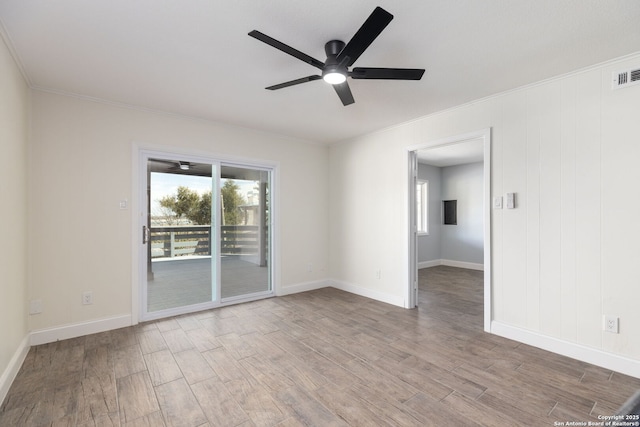 2165 Colleen Dr, Canyon Lake, TX 78133 - unfurnished room with wood finished floors, a ceiling fan, and crown molding