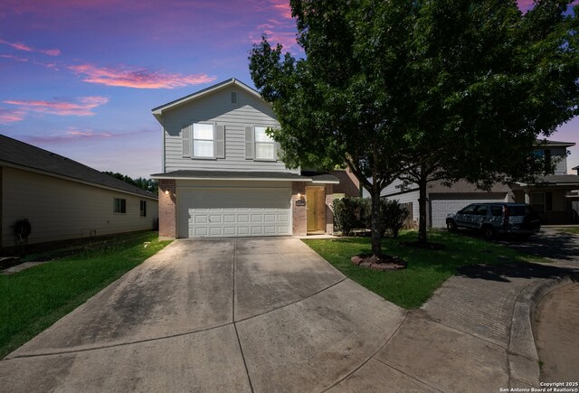 11922 Briarton Wls, San Antonio, TX 78254 - traditional-style home with driveway, an attached garage, a lawn, and brick siding