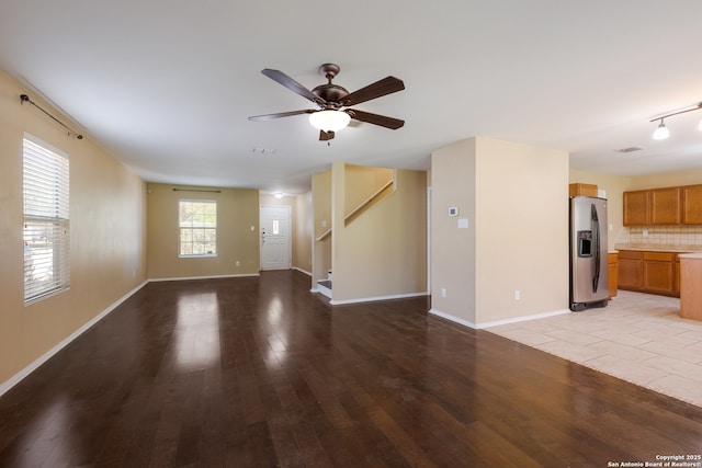 11922 Briarton Wls, San Antonio, TX 78254 - unfurnished living room featuring light wood-style floors, ceiling fan, and stairway