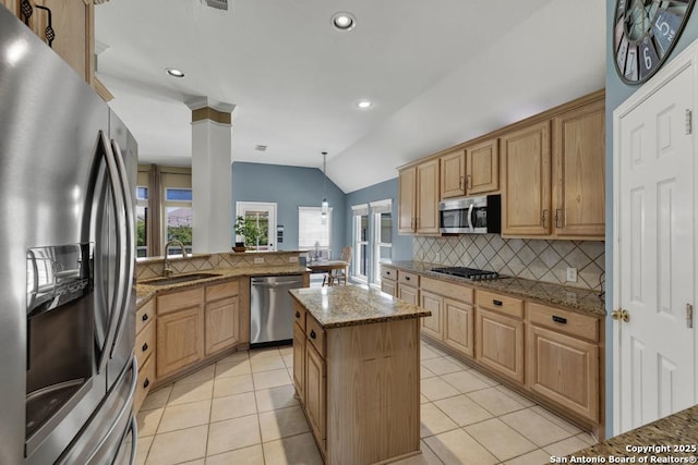 2363 Oak Pebble, New Braunfels, TX 78132 - kitchen with stainless steel appliances, tasteful backsplash, a peninsula, light stone counters, and decorative columns