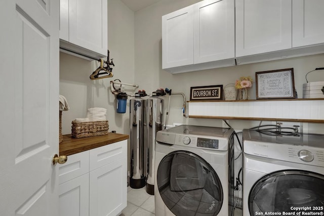 2363 Oak Pebble, New Braunfels, TX 78132 - laundry area featuring cabinet space, washing machine and clothes dryer, and light tile patterned flooring