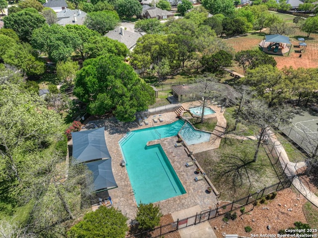 2363 Oak Pebble, New Braunfels, TX 78132 - bird's eye view of a pool area and a tree filled landscape