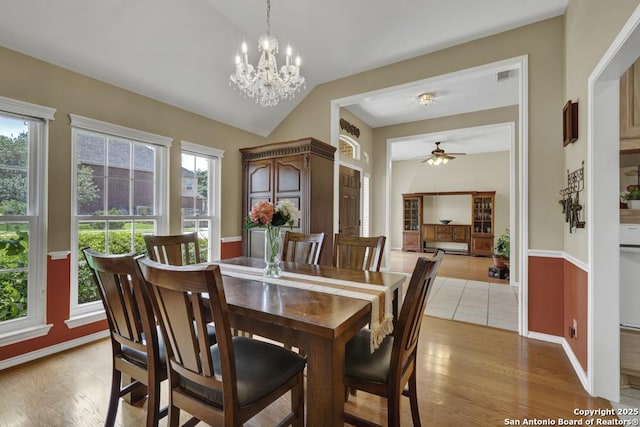 2363 Oak Pebble, New Braunfels, TX 78132 - dining room with vaulted ceiling, light wood-style flooring, a chandelier, and a ceiling fan