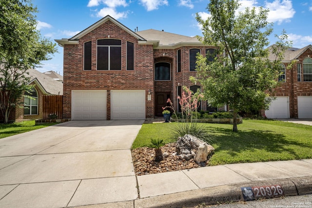 20926 Encino Dawn, San Antonio, TX 78259 - traditional-style house with a garage, a front lawn, brick siding, and concrete driveway