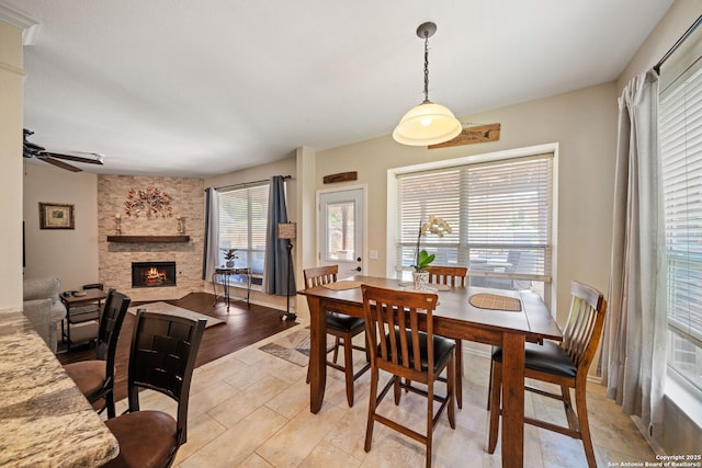 20926 Encino Dawn, San Antonio, TX 78259 - dining area featuring a stone fireplace and ceiling fan