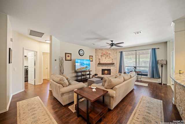 20926 Encino Dawn, San Antonio, TX 78259 - living area with a fireplace, ceiling fan, and dark wood-style flooring