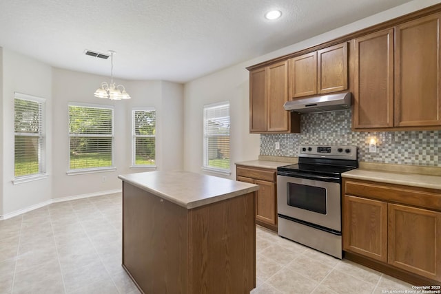 10107 Roseangel, Helotes, TX 78023 - kitchen featuring electric stove, under cabinet range hood, backsplash, brown cabinets, and recessed lighting