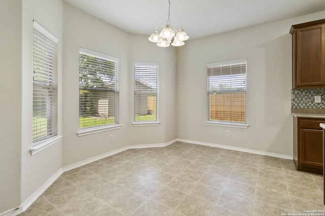 10107 Roseangel, Helotes, TX 78023 - unfurnished dining area with a chandelier and healthy amount of natural light